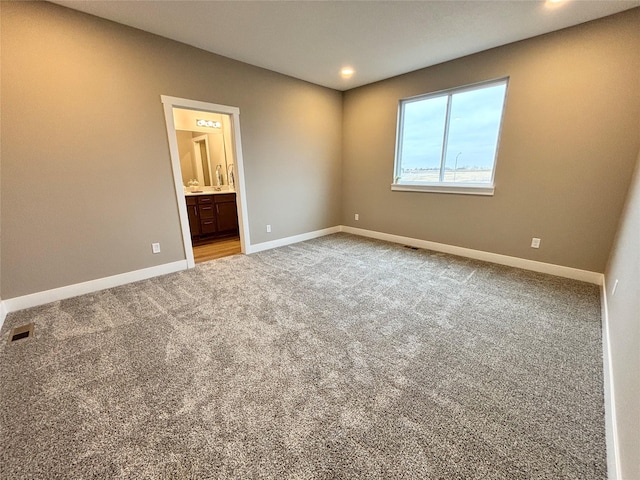 1677 20th Ave SE, Altoona, IA 50009 - carpeted spare room featuring baseboards and recessed lighting