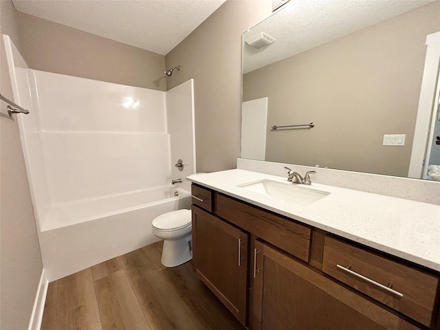 1677 20th Ave SE, Altoona, IA 50009 - full bath featuring wood finished floors, toilet, bathing tub / shower combination, and vanity