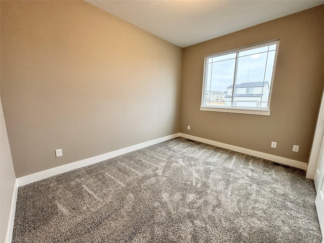 1677 20th Ave SE, Altoona, IA 50009 - carpeted spare room featuring baseboards