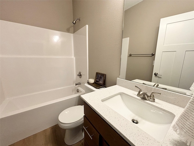 1677 20th Ave SE, Altoona, IA 50009 - full bathroom with toilet, washtub / shower combination, vanity, and wood finished floors