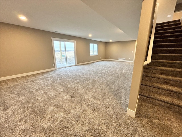 1677 20th Ave SE, Altoona, IA 50009 - below grade area featuring carpet floors, stairway, baseboards, and recessed lighting
