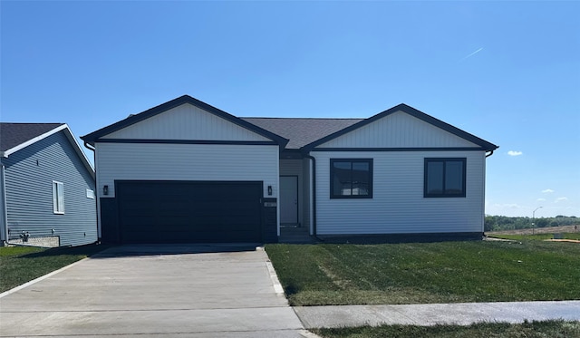 1677 20th Ave SE, Altoona, IA 50009 - view of front of house with a front yard, driveway, and an attached garage