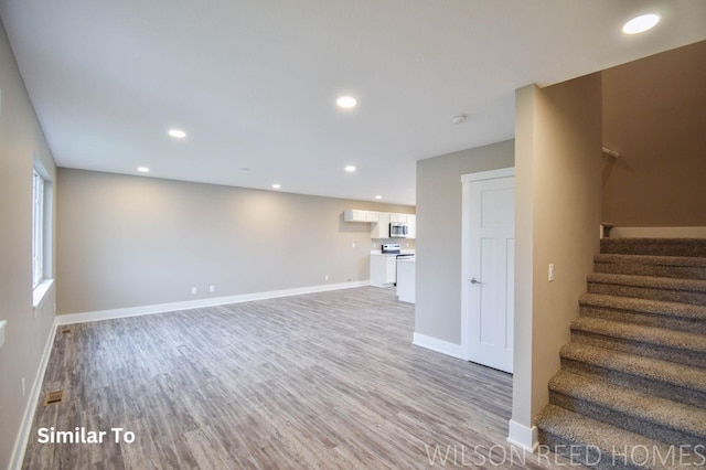 unfurnished living room with light hardwood / wood-style flooring