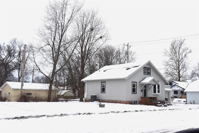 view of front of house featuring cooling unit