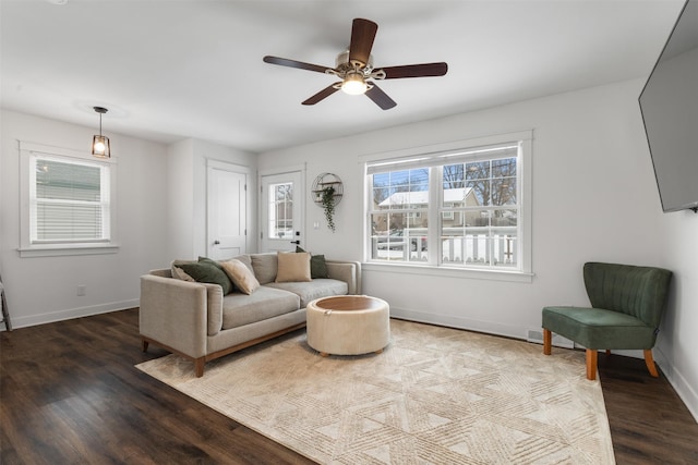 living room with hardwood / wood-style flooring and ceiling fan