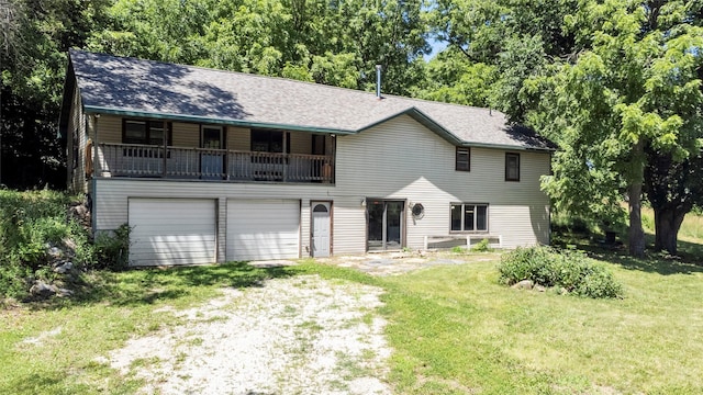 view of front facade with a garage and a front lawn