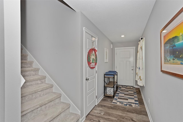 hallway featuring wood-type flooring