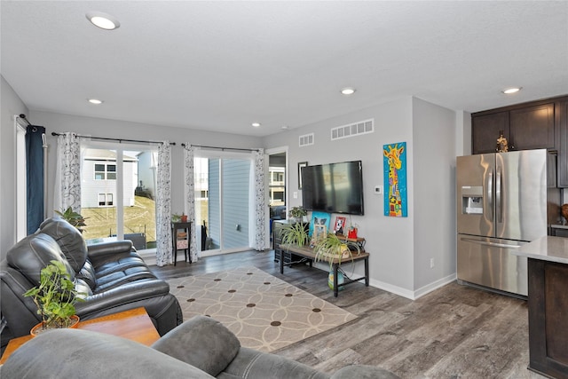 living room with light hardwood / wood-style floors