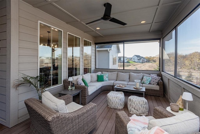 sunroom / solarium with coffered ceiling and ceiling fan