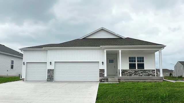 view of front facade with a front yard and a garage