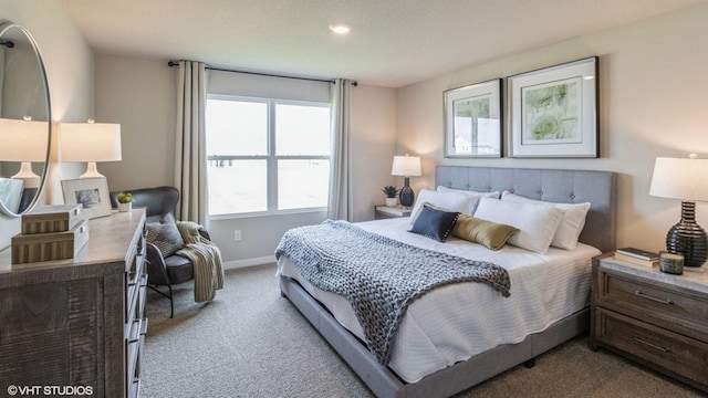 carpeted bedroom with baseboards