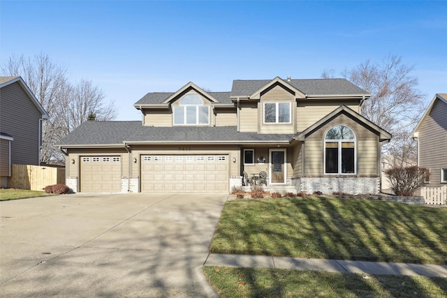 view of front of home featuring a garage and a front lawn