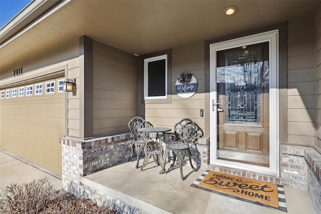 view of exterior entry with a garage