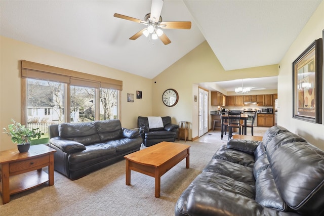 living area with baseboards, light carpet, ceiling fan with notable chandelier, and vaulted ceiling