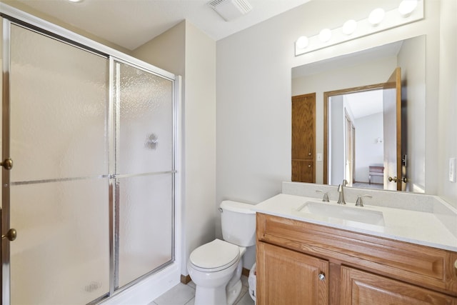 full bathroom featuring visible vents, a shower stall, toilet, tile patterned floors, and vanity