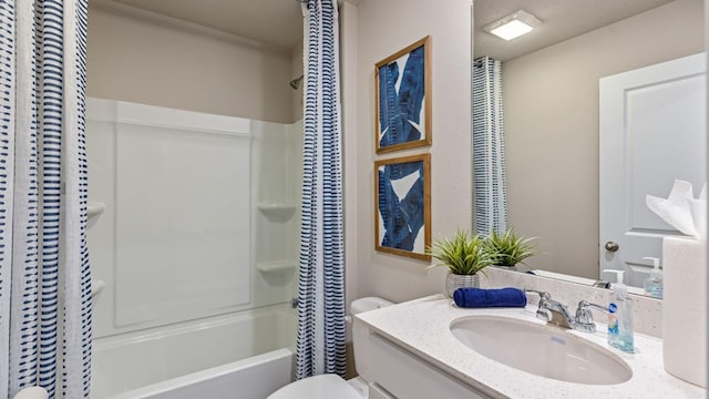 bathroom with toilet, shower / bath combo with shower curtain, and vanity