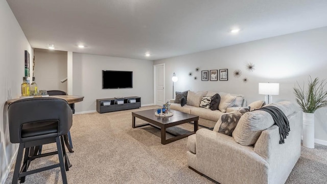 living room with light carpet, recessed lighting, and baseboards