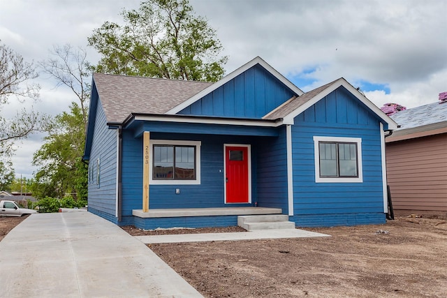 2503 Shaw St, Des Moines, IA 50317 - bungalow-style home with board and batten siding, covered porch, and roof with shingles