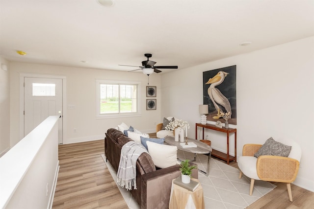2503 Shaw St, Des Moines, IA 50317 - living area featuring light wood-style floors, a ceiling fan, and baseboards