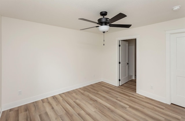 2503 Shaw St, Des Moines, IA 50317 - empty room featuring ceiling fan, light wood-style floors, and baseboards