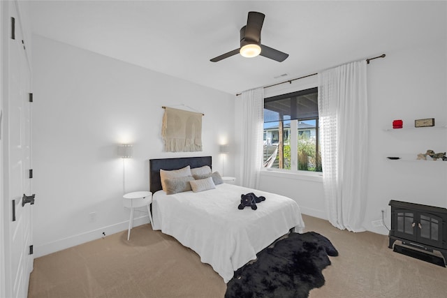 bedroom featuring light carpet and ceiling fan