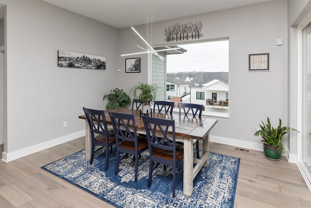 dining space featuring hardwood / wood-style flooring