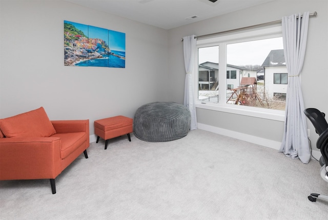 sitting room with light colored carpet