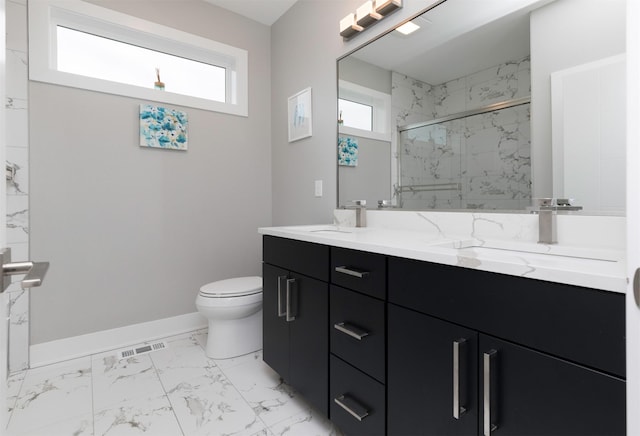 bathroom featuring vanity, toilet, and walk in shower