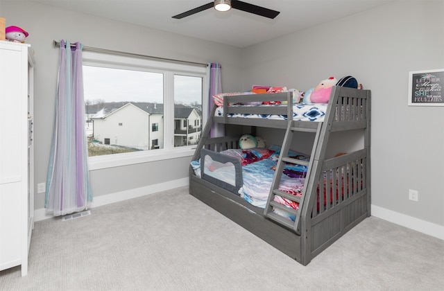 bedroom featuring ceiling fan and light colored carpet