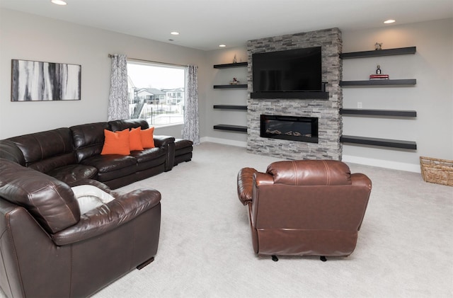 carpeted living room featuring a fireplace