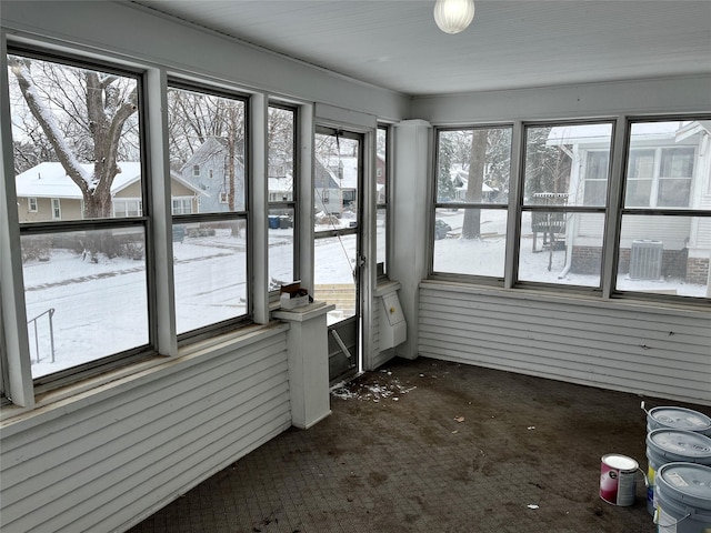 unfurnished sunroom featuring a wealth of natural light