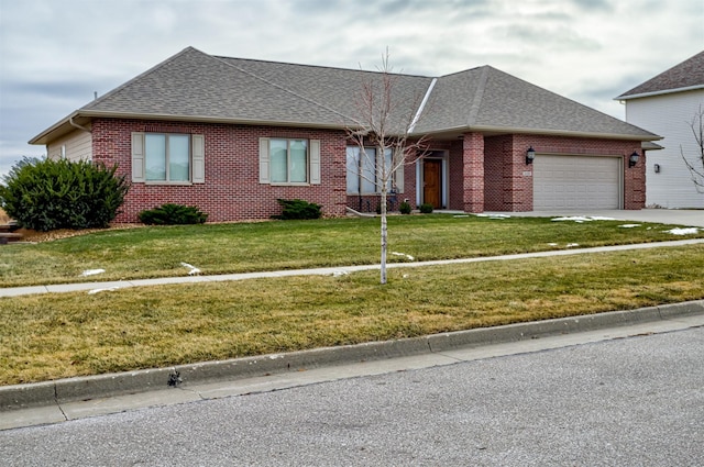 single story home featuring a front yard and a garage