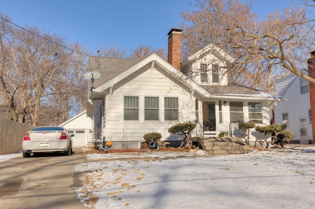 bungalow-style house featuring a garage