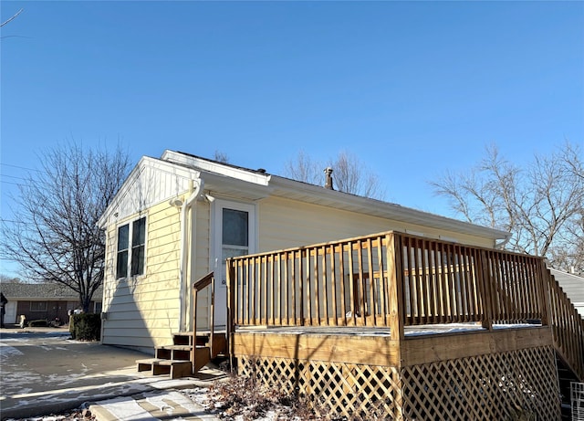 view of side of property featuring a deck