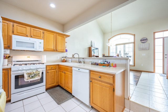 kitchen with kitchen peninsula, sink, pendant lighting, and white appliances