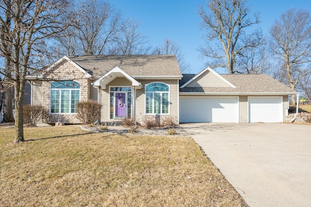 single story home with a front yard, roof with shingles, driveway, stone siding, and an attached garage