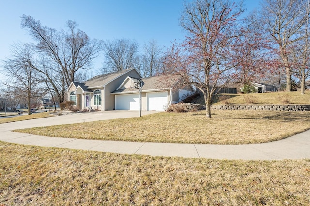 view of front of home with driveway, a front lawn, and a garage