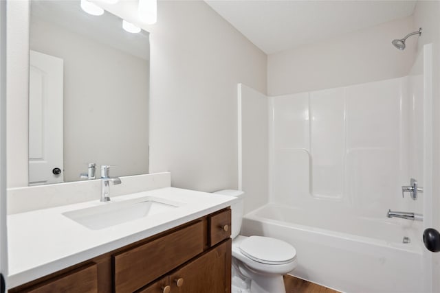 full bathroom with vanity, toilet, wood-type flooring, and bathing tub / shower combination