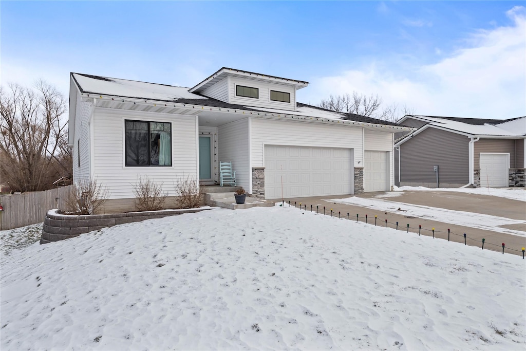 view of front of property with a garage