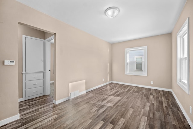 unfurnished room featuring hardwood / wood-style floors