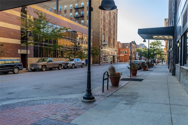 view of road featuring sidewalks and street lighting