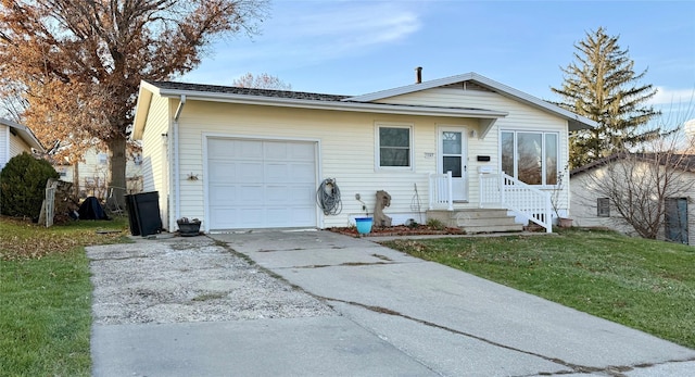 view of front of home featuring a garage and a front lawn