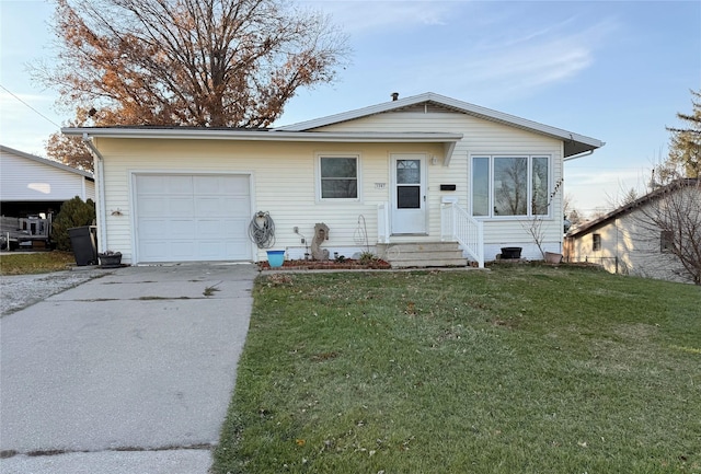 view of front of home featuring a garage and a front lawn