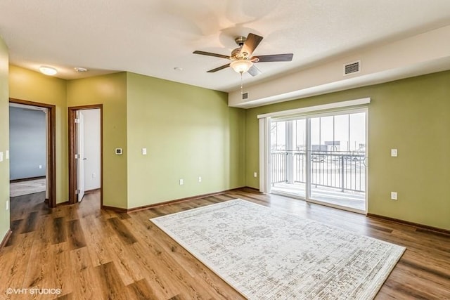 spare room featuring ceiling fan and wood-type flooring