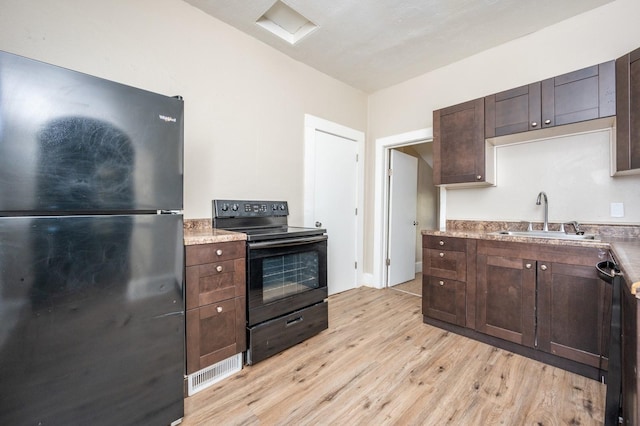 kitchen featuring dark brown cabinetry, sink, black appliances, and light hardwood / wood-style floors