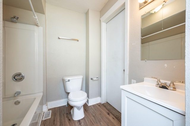 full bathroom featuring vanity, wood-type flooring, tub / shower combination, and toilet