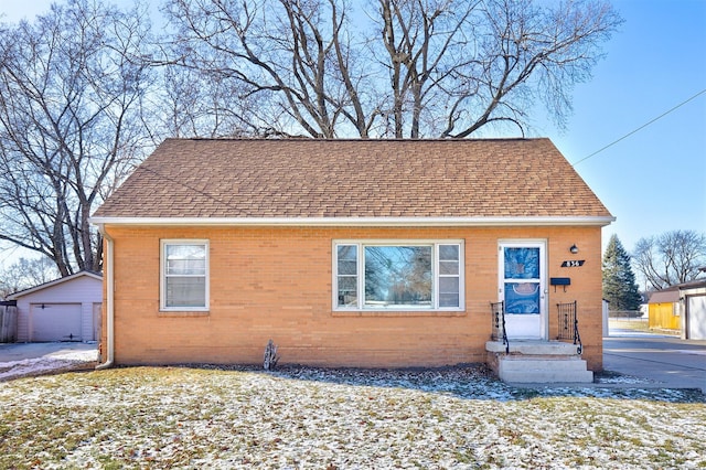 view of front facade with an outdoor structure and a garage