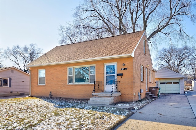 view of front facade with an outbuilding and a garage