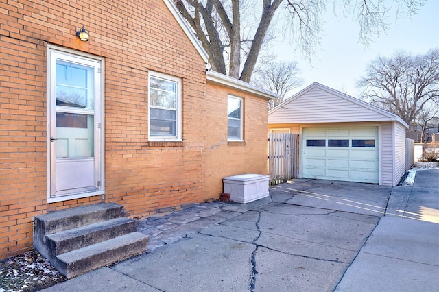 exterior space featuring an outbuilding and a garage