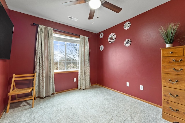 unfurnished room with ceiling fan and light colored carpet